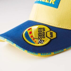 Sportcap met geweven logo en geweven badge